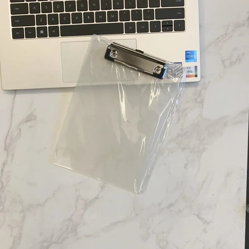 Transparent A4 clipboard with metal clip holding white paper, available in blue, green, red, and white.