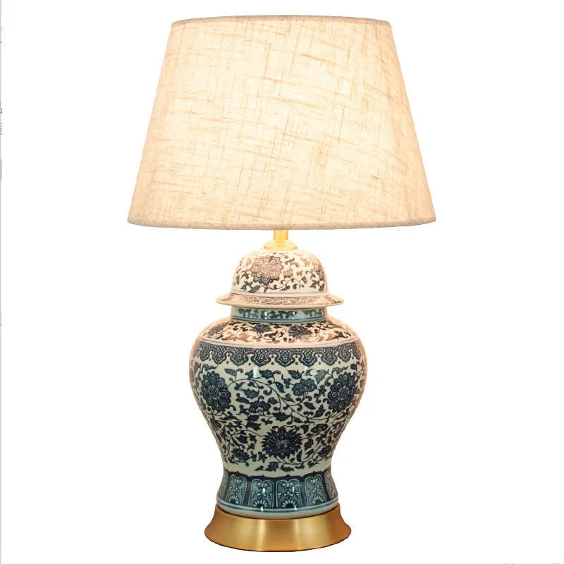 Blue and white porcelain Chinese table lamp with handmade ceramic body and cloth shade