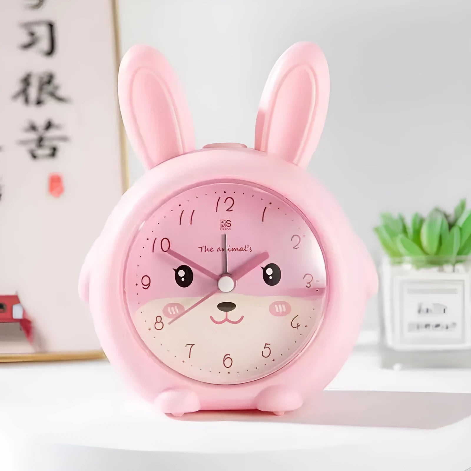 Children's cartoon alarm clock with singing function in pink or blue ABS plastic