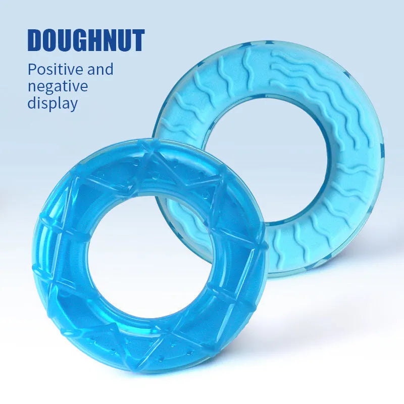 Assorted dog cooling toys including water-filled popsicles, silicone pacifier chews, and rope-attached ring in bright colours