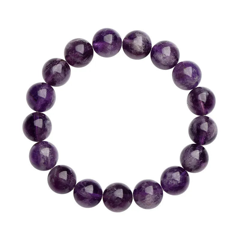 Natural Feather Amethyst crystal bracelet with Ruyi charm beads on a wrist.
