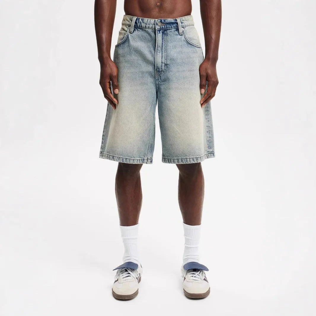 Men's loose straight-leg cotton jeans in light blue, black, or grey colour options.