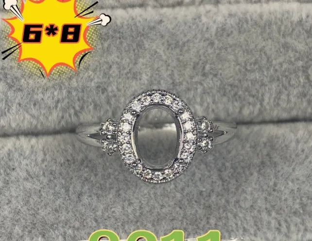 Open-mouth oval denier ring with a 6x8mm stone and five-pointed star decoration on a copper band.