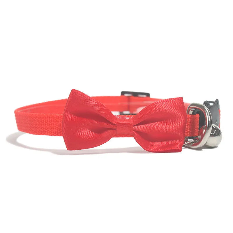 Adjustable striped nylon cat collar with a small bell, shown in multiple colour options on a white background.