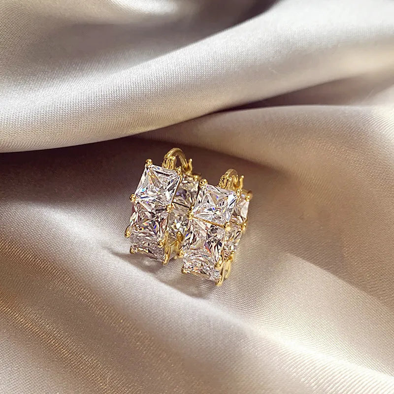 Gold-plated geometric U-shaped earrings with round black zircon crystal stones