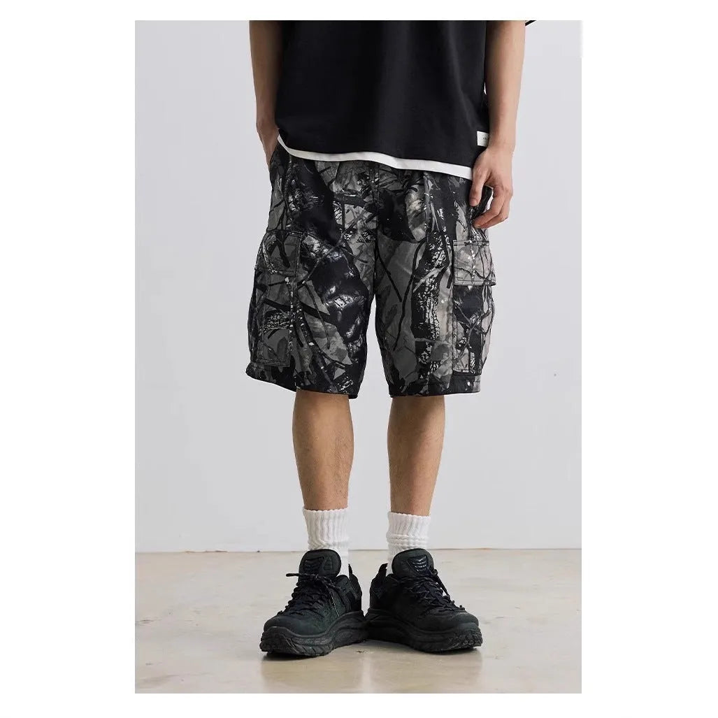 Straight-leg denim shorts in black and army green colours showing loose casual fit and mid waist design