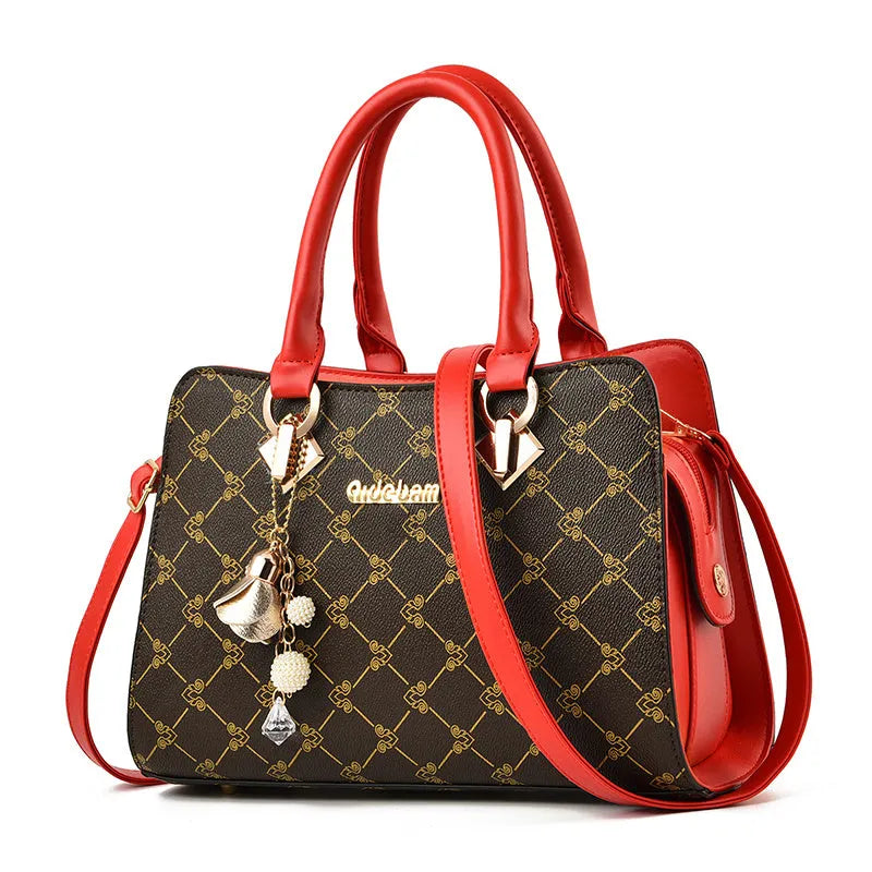 Women's geometric pattern print messenger bag in PU leather with zipper closure and internal organisers.