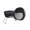 Small round metal camping stove with folding legs, mesh grill pan, charcoal clip, and carry bag.