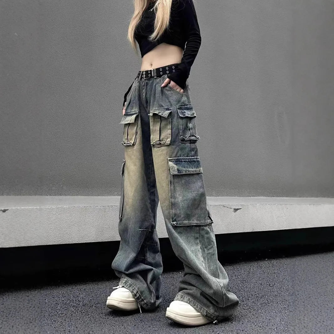 Loose-fit distressed denim jeans with multiple pockets in light blue wash, straight-leg street hipster style