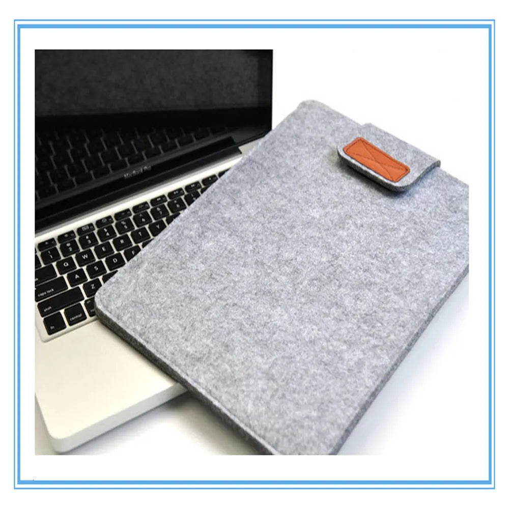Khaki clamshell laptop bag open to show plush interior and corner protectors for tablet and notebook
