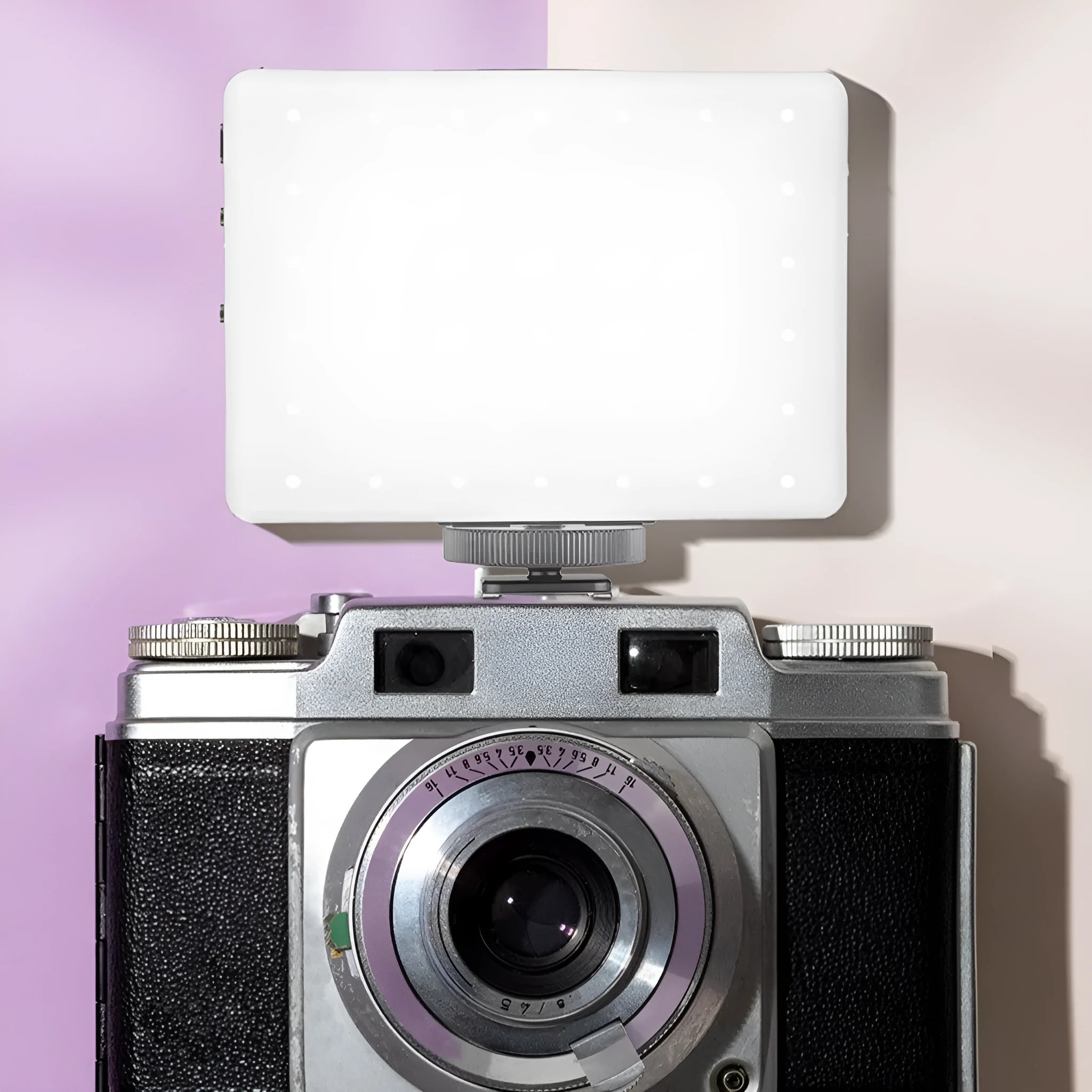 Portable pocket fill light with clip attachment for mobile phones, measuring 10.4cm wide
