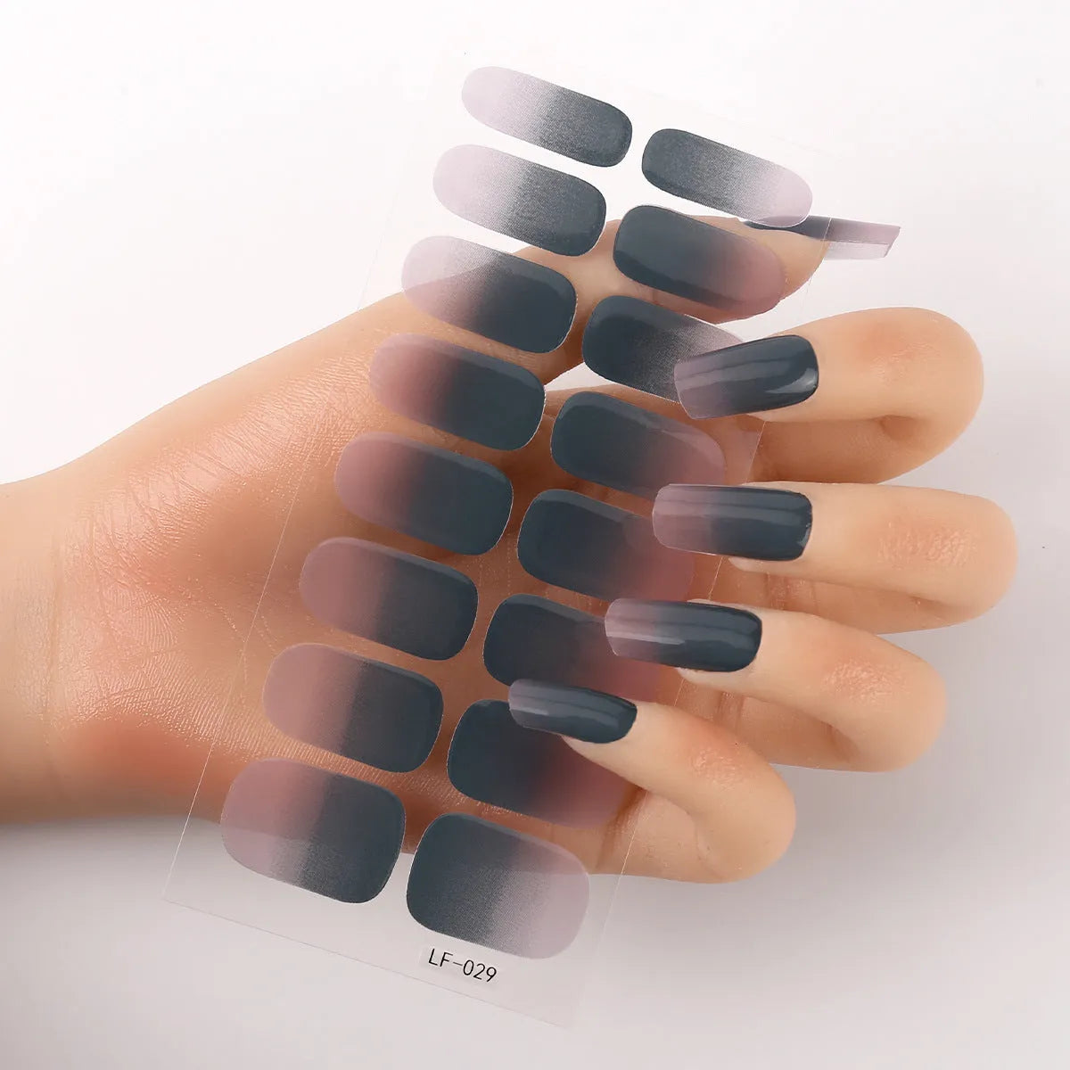 Set of 16 solid colour full nail art stickers showing patterns like cross, rose, tulip, and cartoon designs.