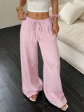 Women's black wide-leg trousers with lace-up waist trimming detail on mid-rise waist
