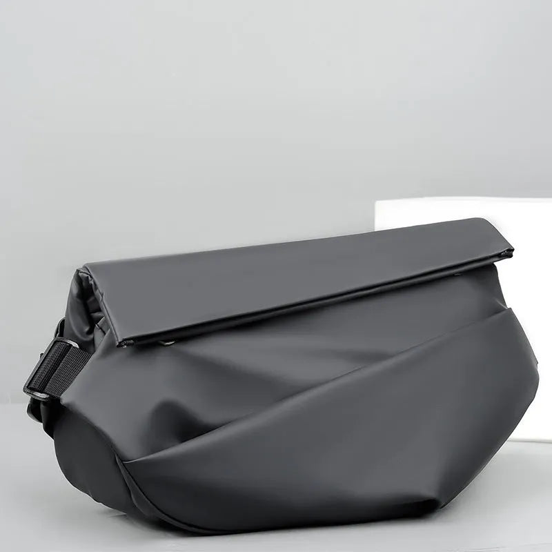 Grey medium-sized PU leather crossbody sling bag for men with a horizontal square shape.