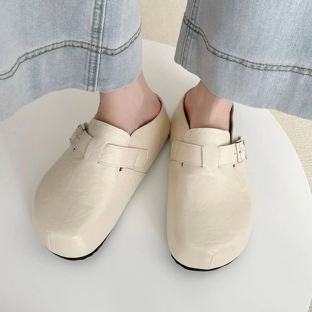 Women's flat buckle casual sneakers in yellow, creamy-white, silver, and black colours with round toe design