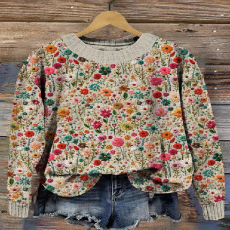 Little flower digital print on a round neck polyester sweater, shown on a hanger.
