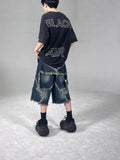 Blue denim shorts with frayed five-pointed star design and loose retro fit