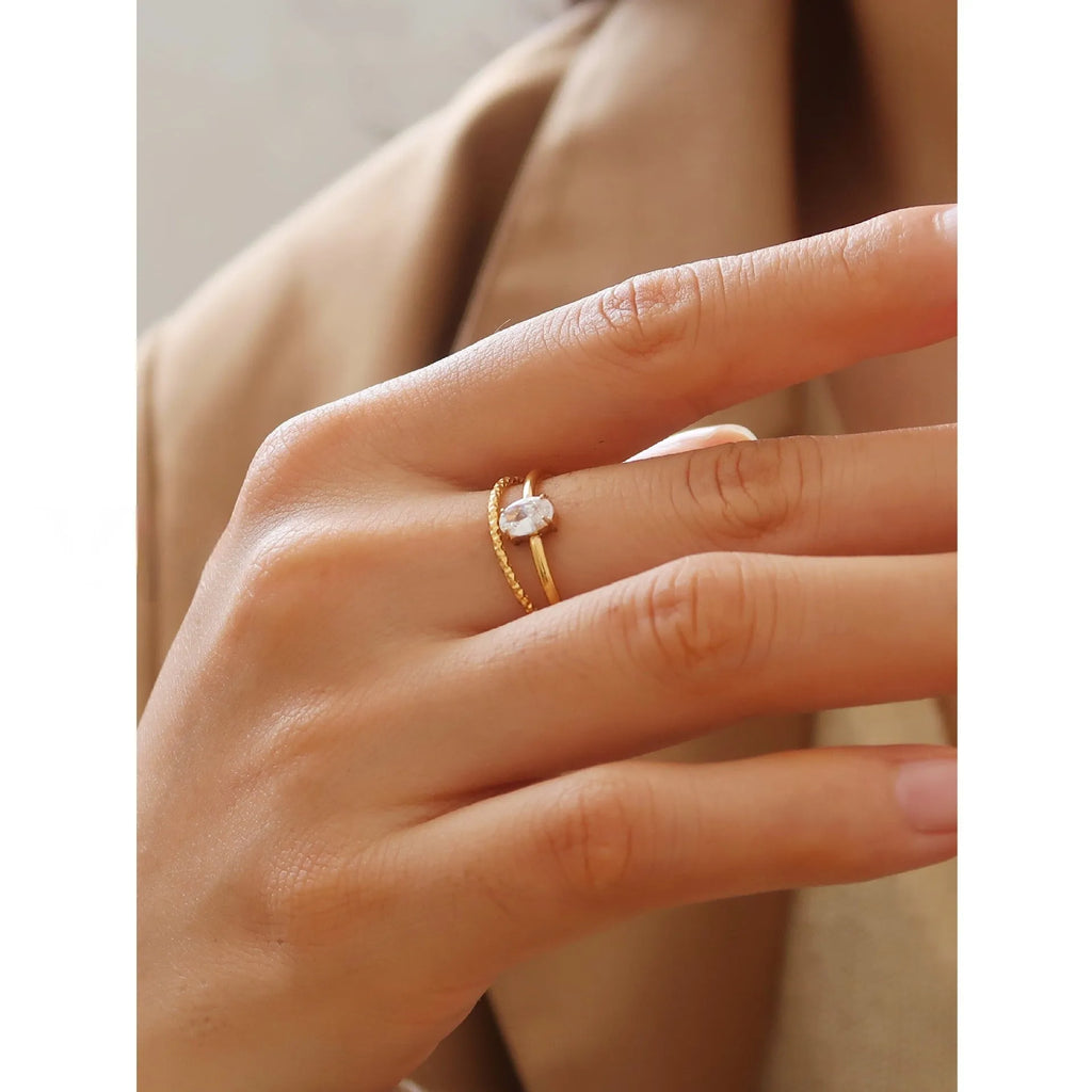 Golden electroplated stainless steel ring with love heart shape and oval bath design