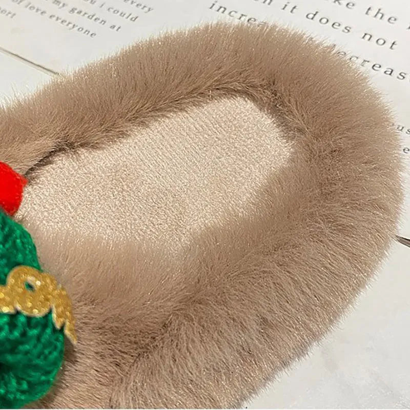 Women's Christmas slippers with a red hat decoration on a faux plush upper, shown in black.
