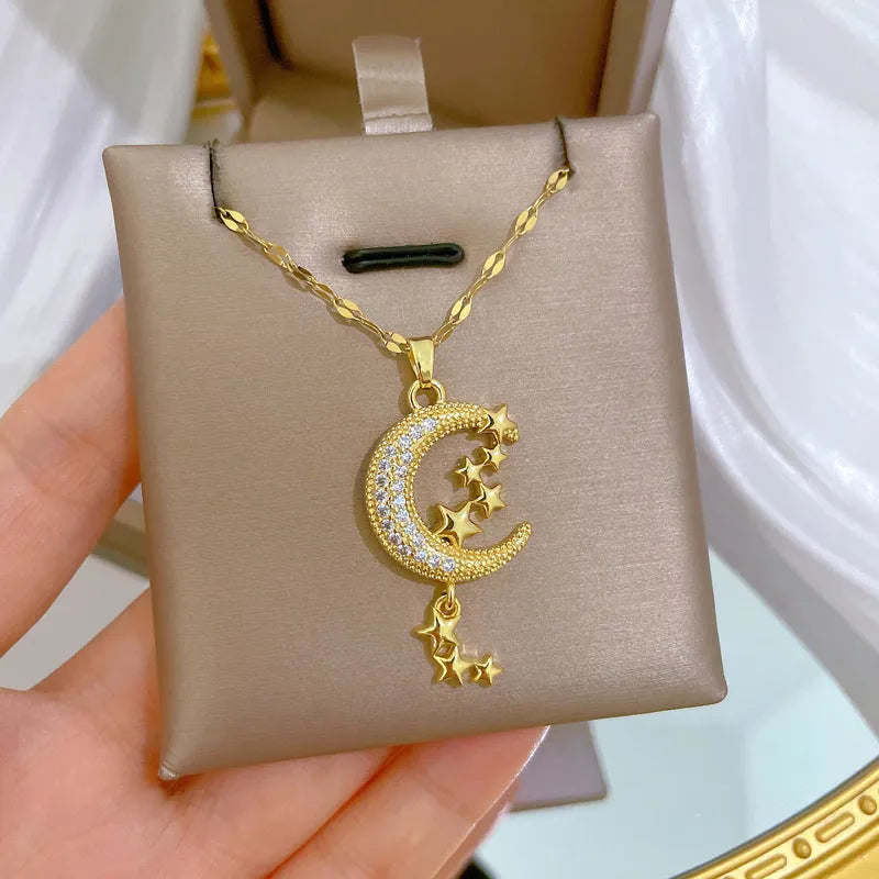 Stainless steel and copper moon pendant necklace with geometric diamond pattern and tassel design