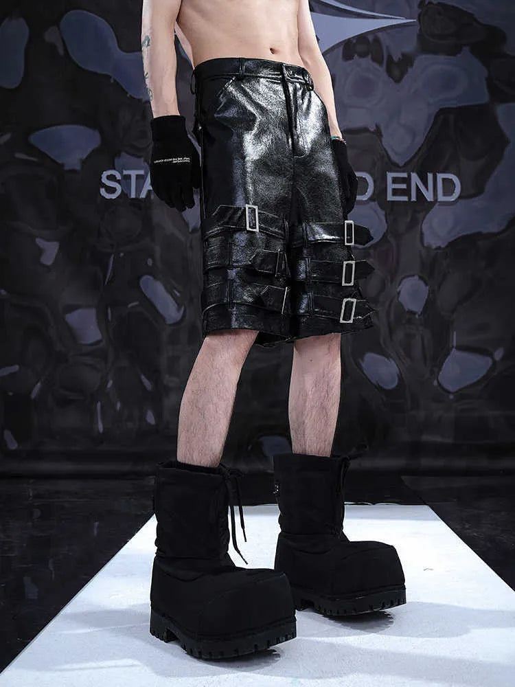 Black men's spandex leather-look shorts with a cropped, casual fit and medium-low waist.