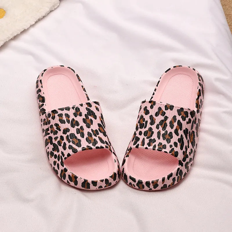 Women's leopard print EVA slippers with thick sole on a white background.