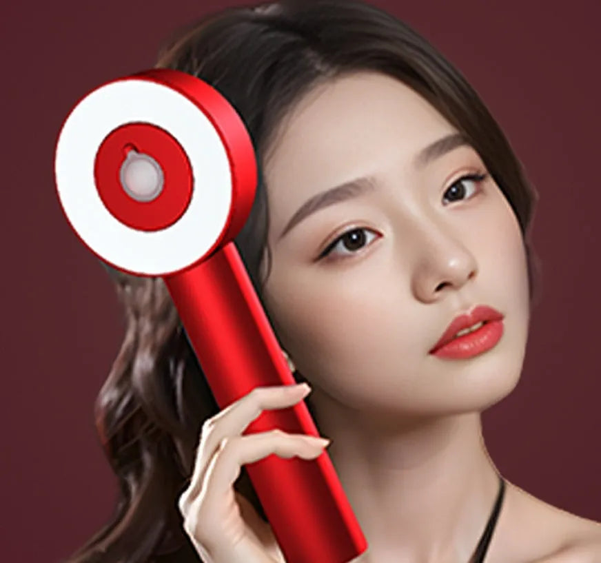 A handheld red and blue light therapy massage hair comb with a plastic body and Type-C charging port.