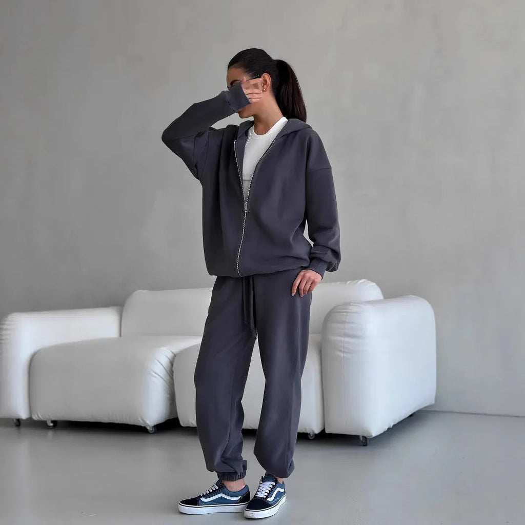 Women's red street style two-piece set with long-sleeved coat and matching trousers, loose fit.