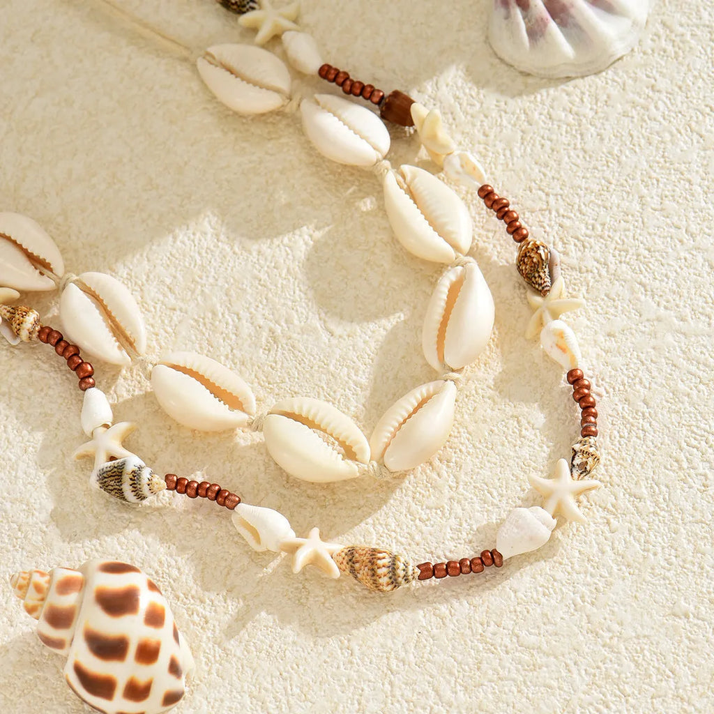 Natural shell geometric pendant necklace for women, handcrafted, bohemian style, colour X1900, on a regular chain.