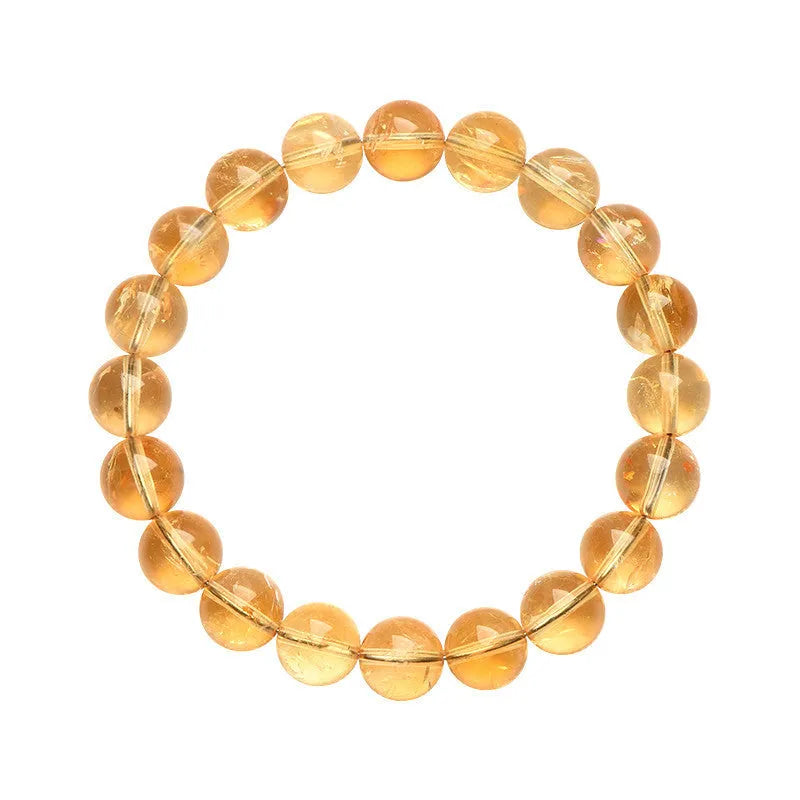 Natural yellow Asestelle citrine bracelet with hand-ground geometry beads on a wrist.