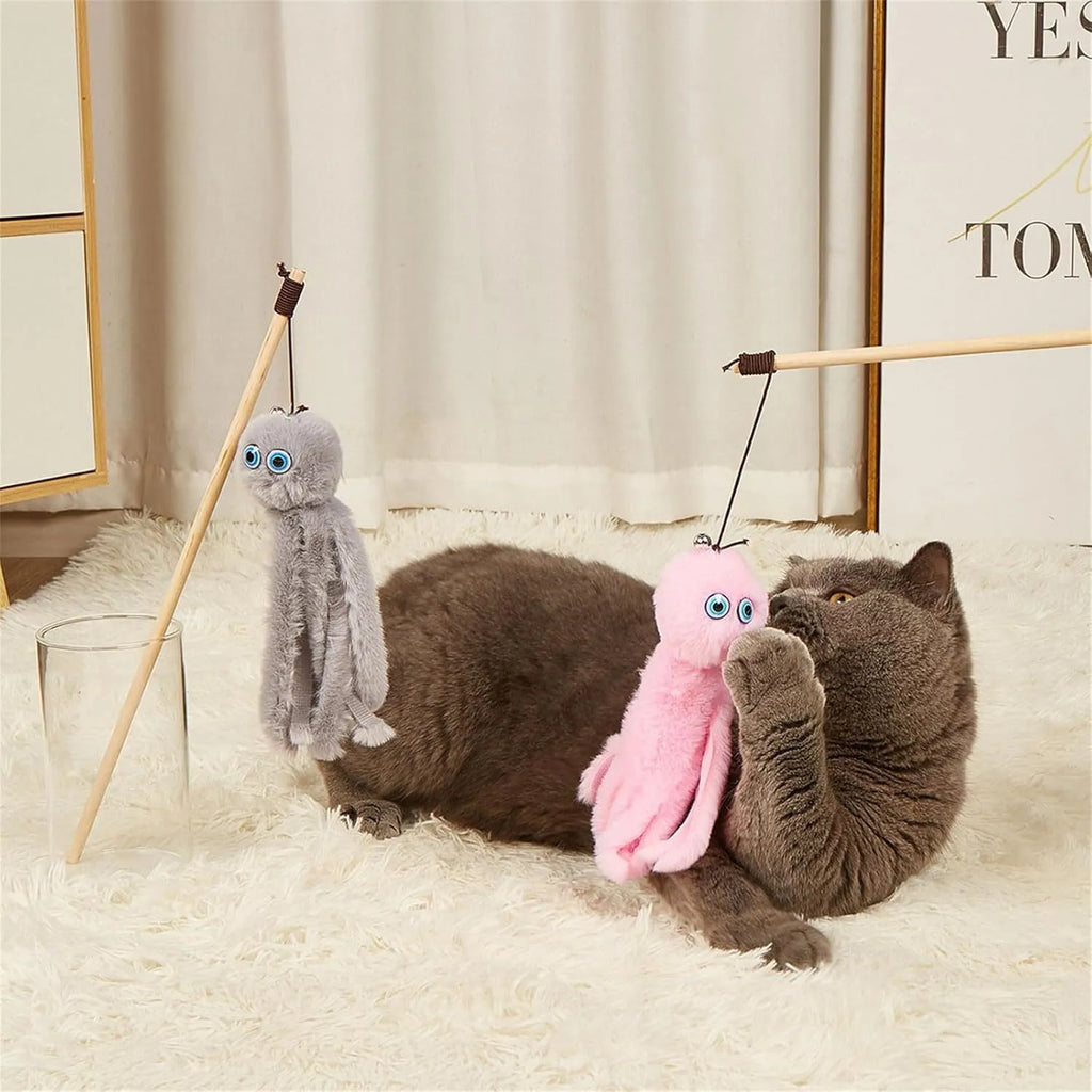 Grey furry octopus cat toy with eyes on a long stick for interactive indoor play with kittens.