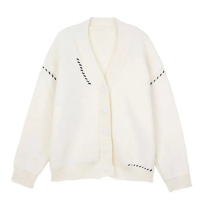 Women's loose fit black knitted cardigan coat with long sleeves on a hanger.