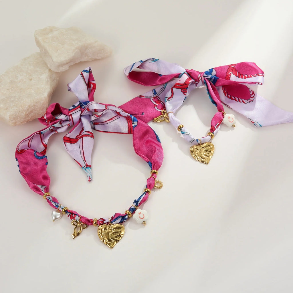 Gold geometric necklace and bracelet set with stainless steel construction and matching pendant designs