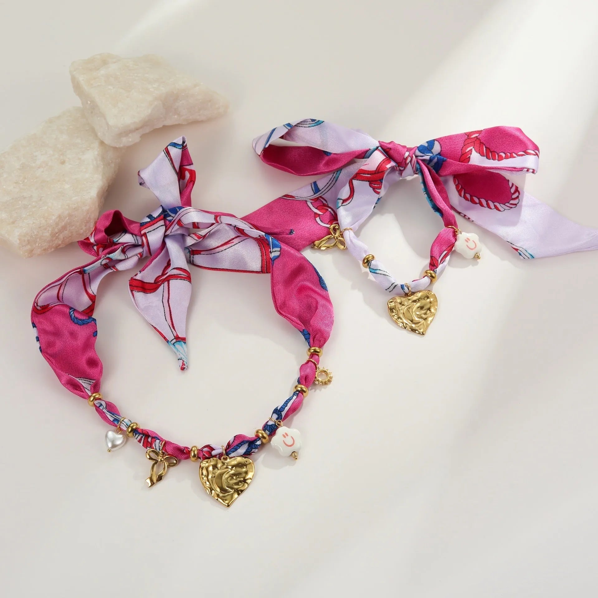 Gold geometric necklace and bracelet set with stainless steel construction and matching pendant designs