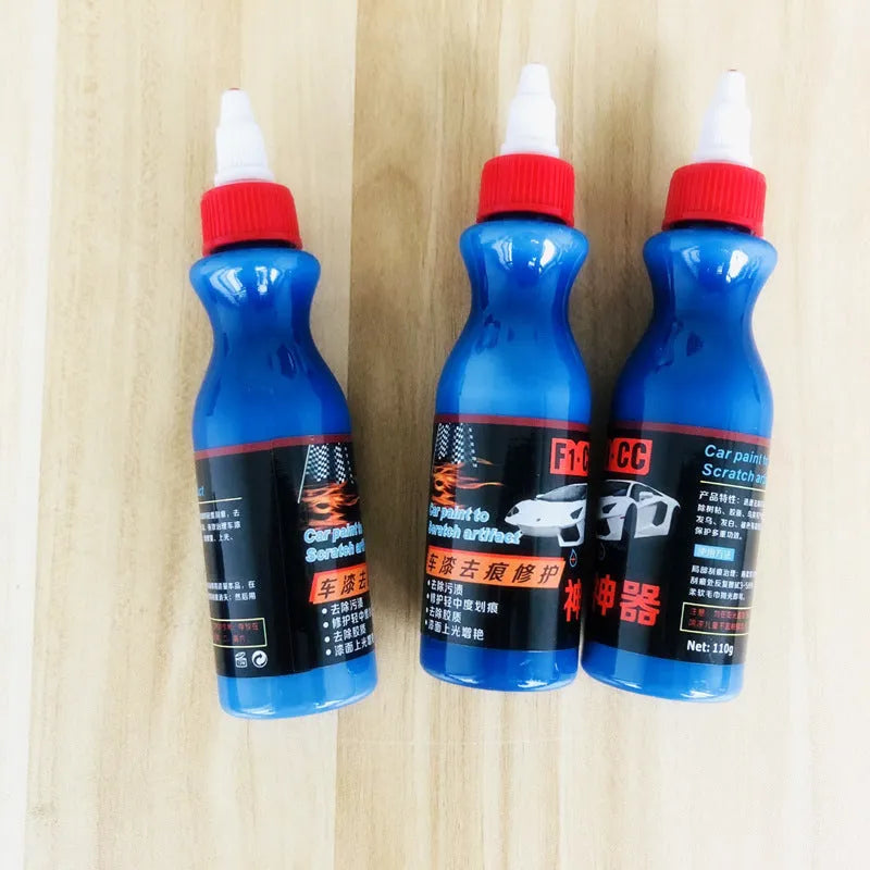 Small blue container of car scratch repair agent with sponge applicator for vehicle paint touch-ups