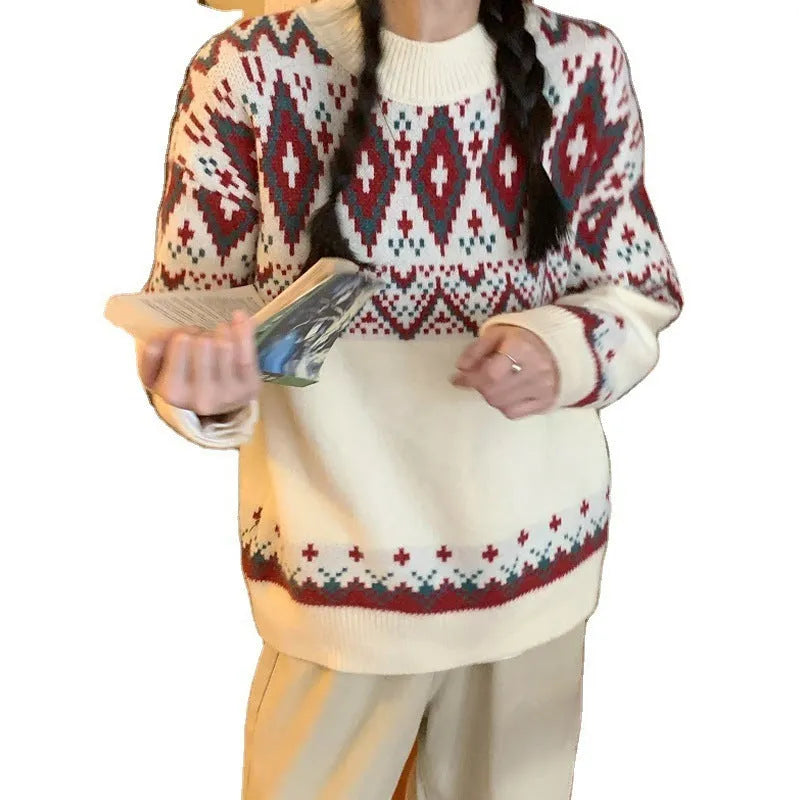 Red and white striped loose retro-style long sleeve pullover knitted top on a hanger.