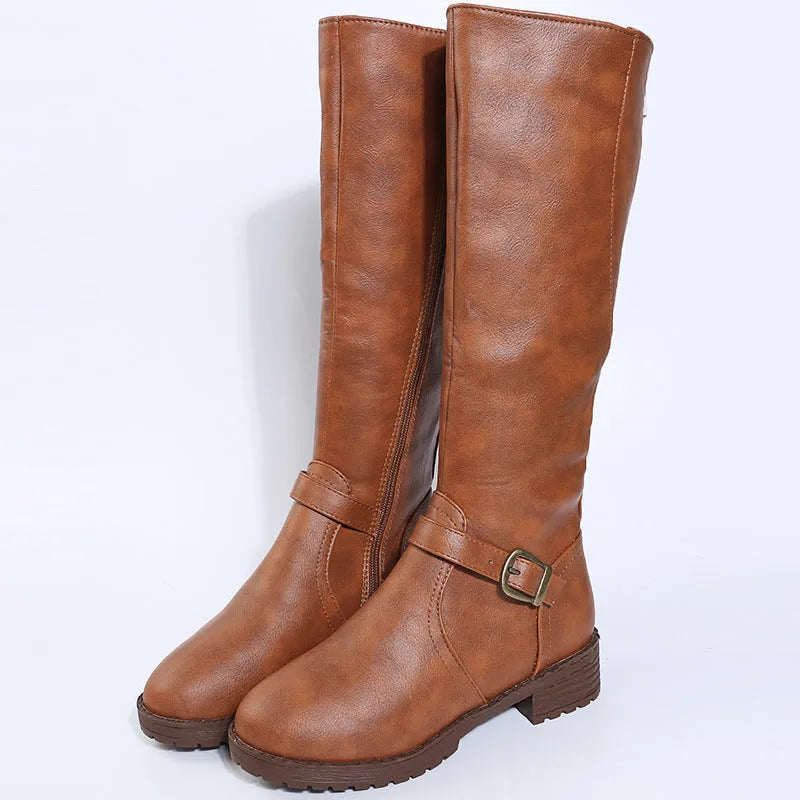 Women's yellow knight high boots with buckle details on shaft and a square heel.