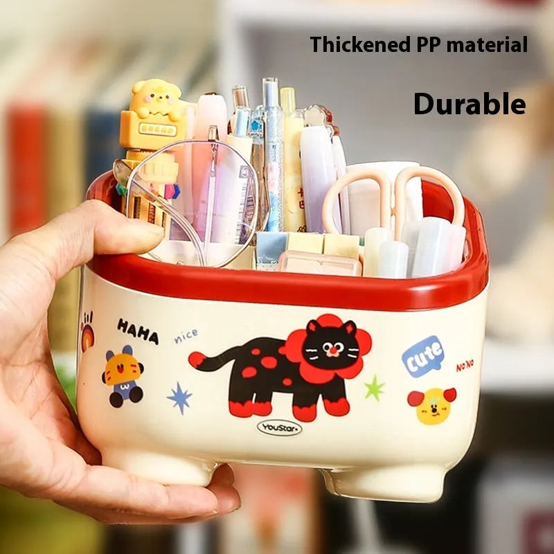 Cartoon-style red and brown plastic desktop storage box with grid compartments for organising pens and stationery.