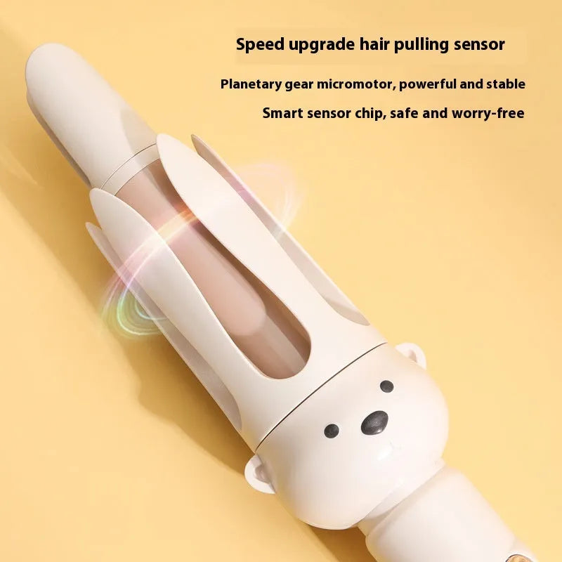 Beige anion automatic hair curler with wired power cord and included hair stick on a white background.