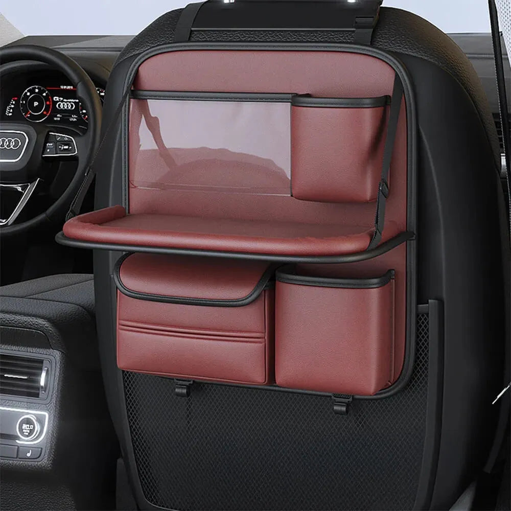 Car seat lazyback storage bag in Obsidian Black with foldable dining table extended, hanging on a car front seat backrest