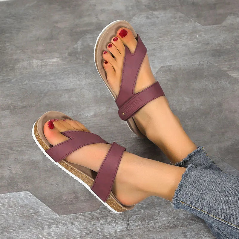 Flat toe ring thick-soled flip-flop in a solid colour on a plain background