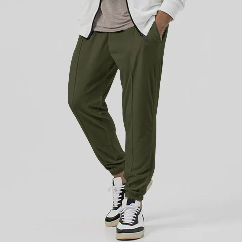 Men's loose tapered casual track sweatpants in cotton blend fabric showing straight-leg design