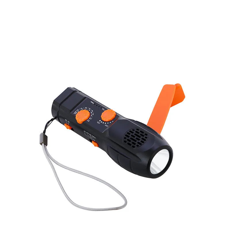 Hand-cranked emergency radio flashlight with USB charging port built-in speaker and manual tuning dial in black