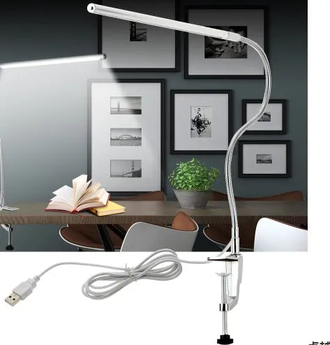 Silver USB-powered LED clip-on table lamp with long arm extended, showing the lamp head and clip mount.