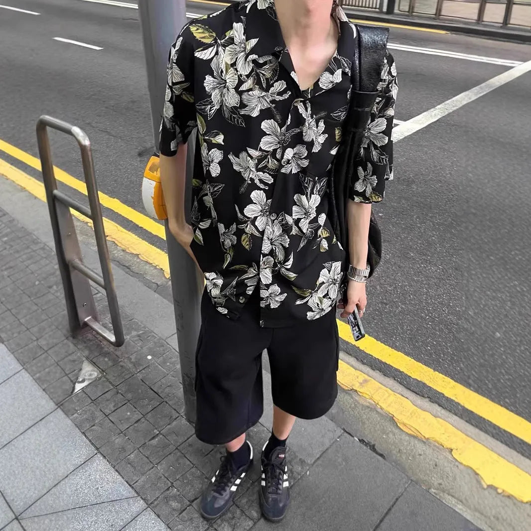 Black men's short sleeve shirt with floral print, Cuban collar, and loose cardigan fit.
