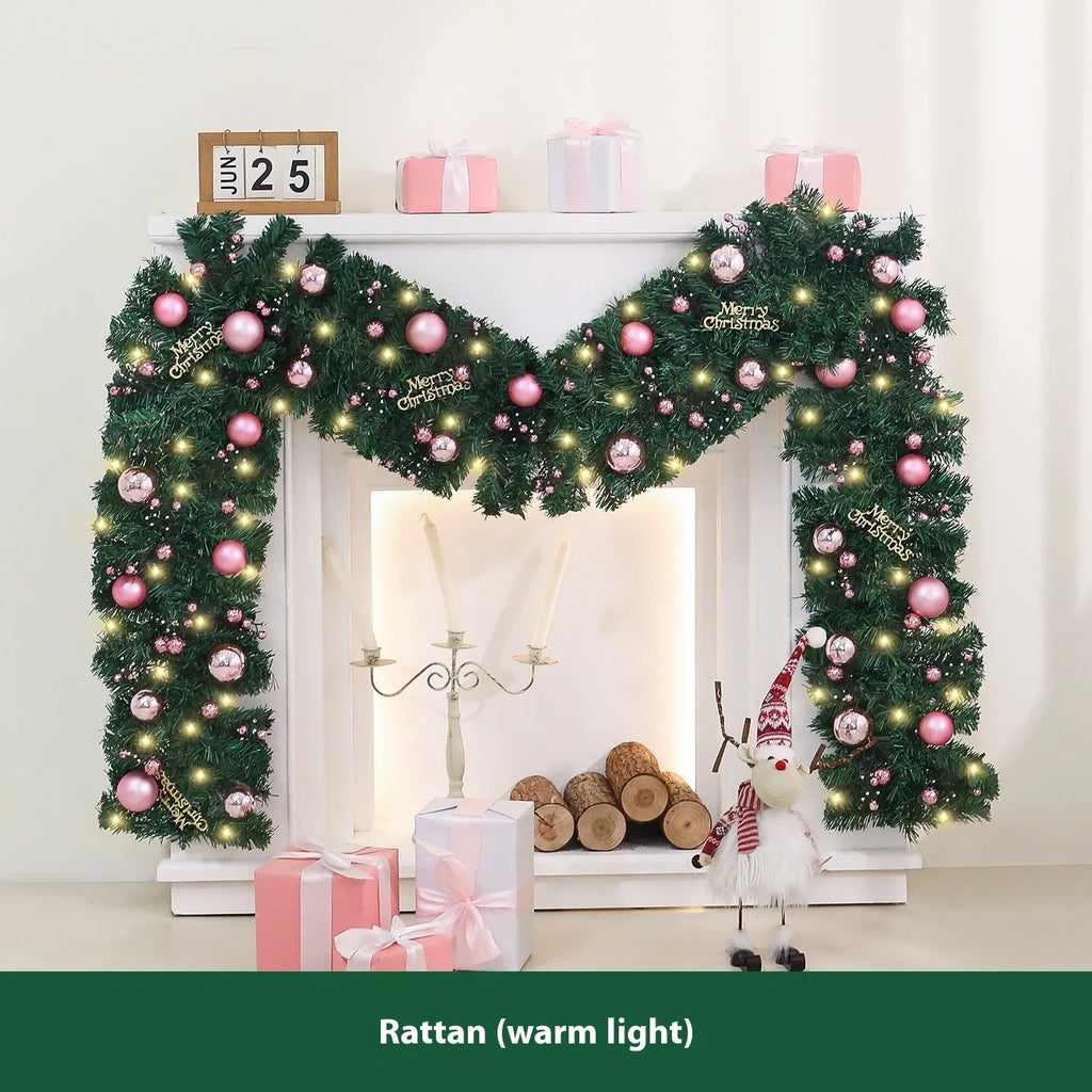 2.7 metre pink artificial rattan Christmas vine decoration with small fruit accents and LED lights