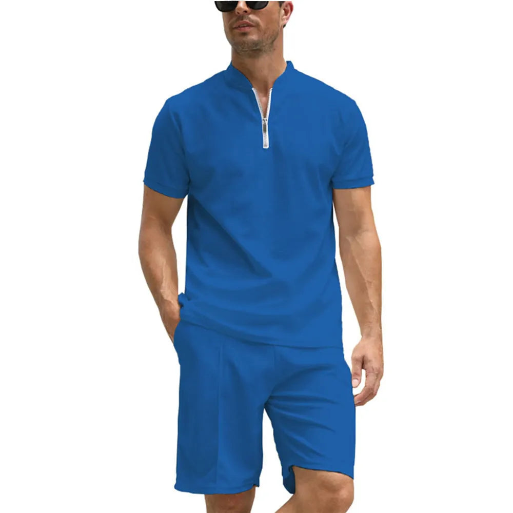 Man wearing a solid colour polo shirt and matching trousers from a two-piece set in beaded bird's eye polyester fabric.