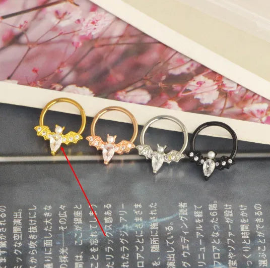 Closed-loop bat nose ring in stainless steel electroplated silver finish with star shape and moon elements