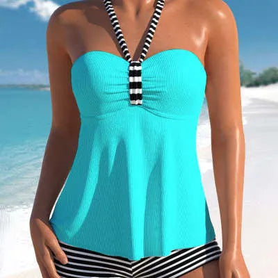 Women's off-shoulder one-piece swimsuit in solid white and black/white striped patterns.