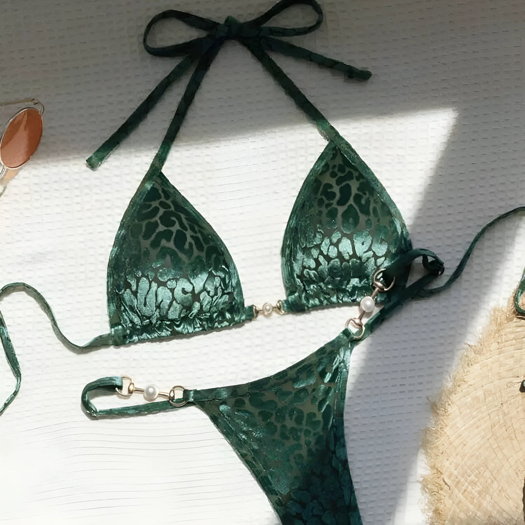 Women's blue leopard print T-shaped bikini swimsuit made from polyester and spandex fabric.